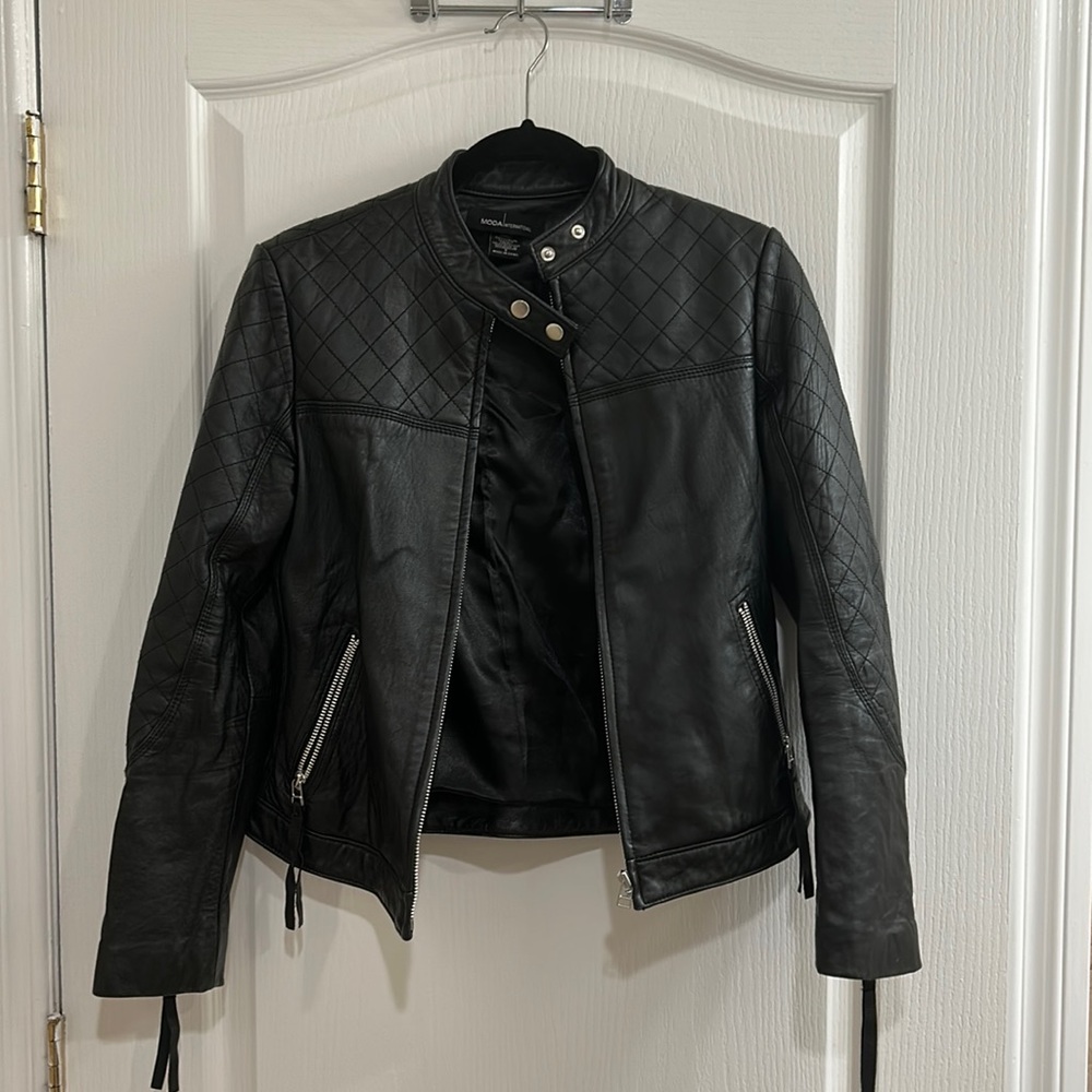 Black leather jacket size small with tassel zip sleeves and pockets